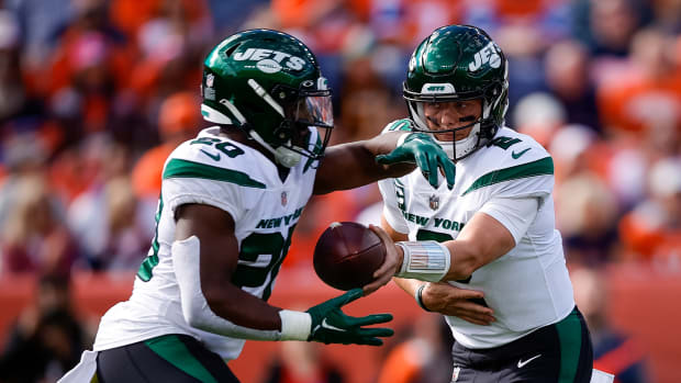 Jets' RB Breece Hall takes a handoff from QB Zach Wilson